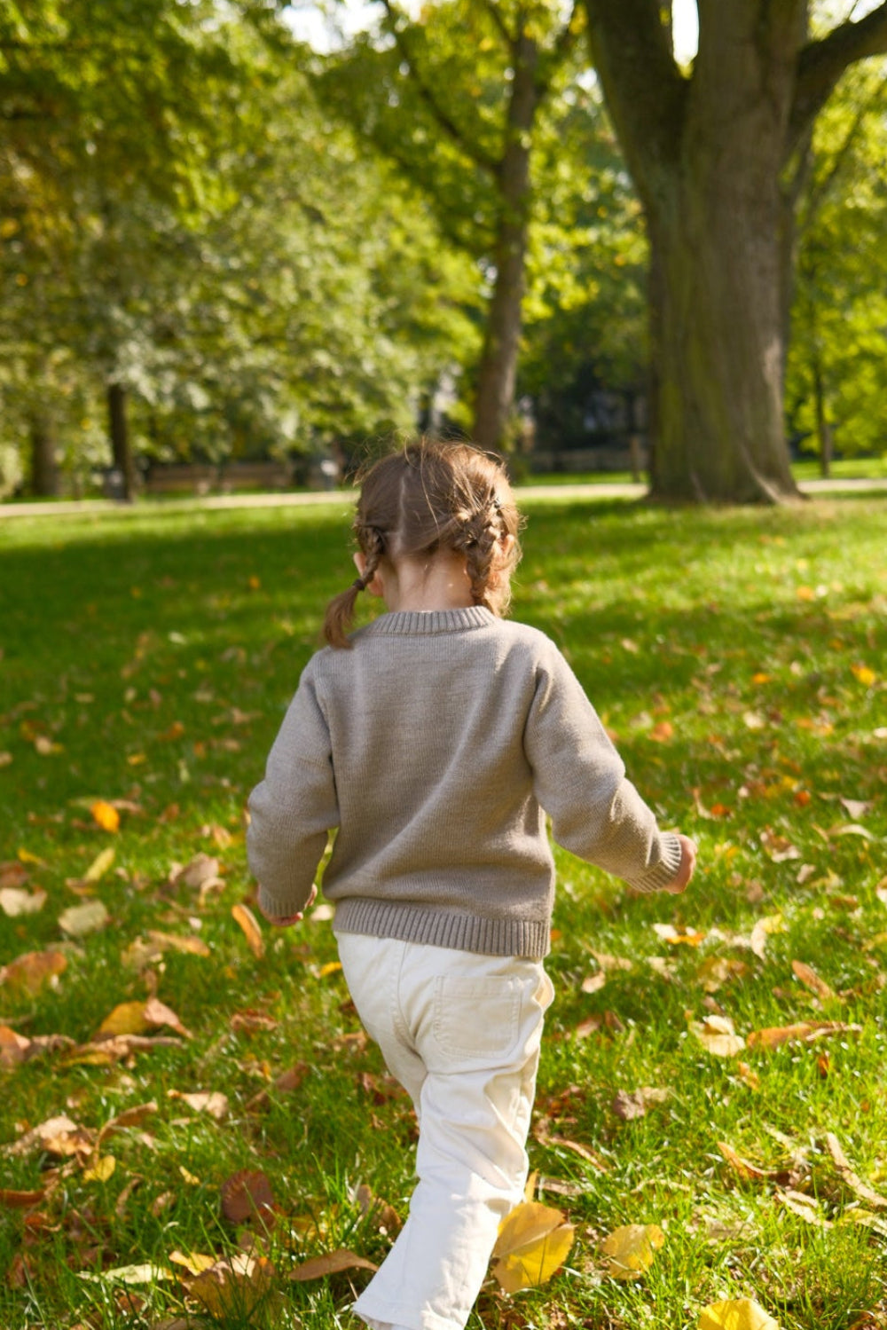 TANSY children's merlot red merino wool sweater, lifestyle photograph