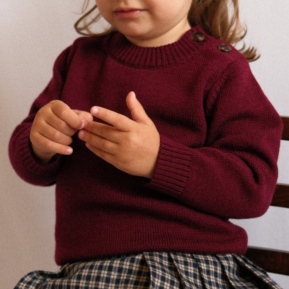 Editorial photograph from the TANSY children's merino wool knitwear collection