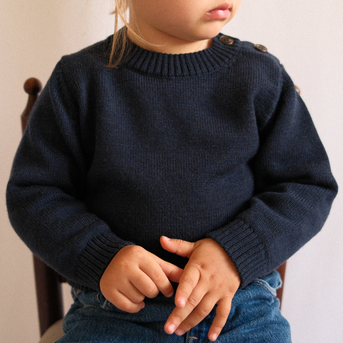 TANSY navy merino wool sweater for children, editorial photograph