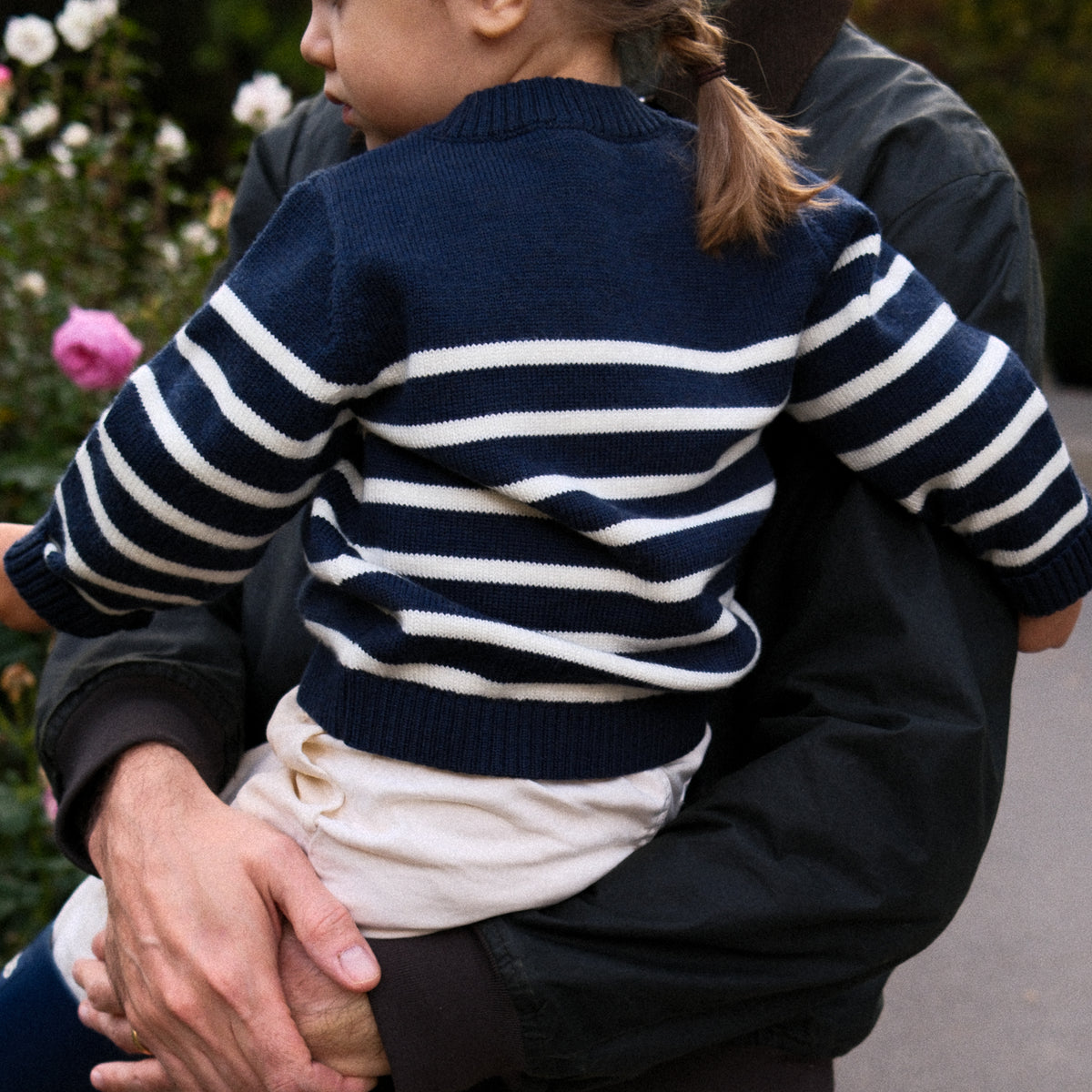 Little girl wearing breton striped nautical inspired wool children's sweater